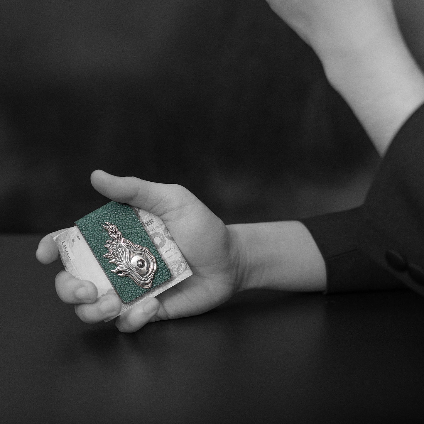 Man holding Galuchat Leather Money Clip with Dragon Fish Eye